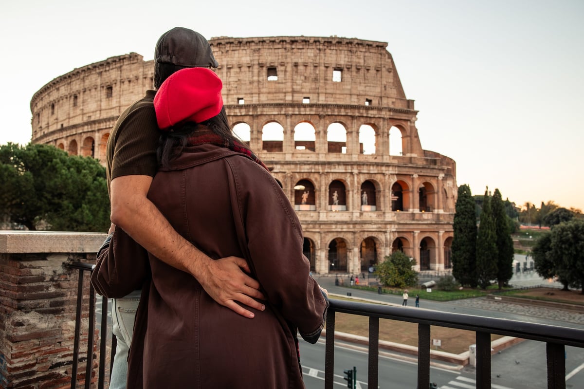 Couple embracing while traveling, capturing romance and connection during a Mediterranean adventure